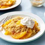 Easy peach cobbler with cake mix in rustic dish
