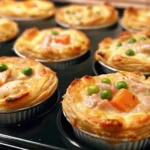 Mini chicken pot pie biscuits baked golden in muffin tin