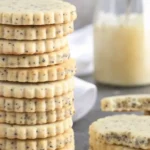 Freshly baked lemon poppy seed cookies with a sprinkle of poppy seeds