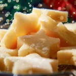 Beautifully decorated soft cut out sugar cookies in various shapes on a wooden table